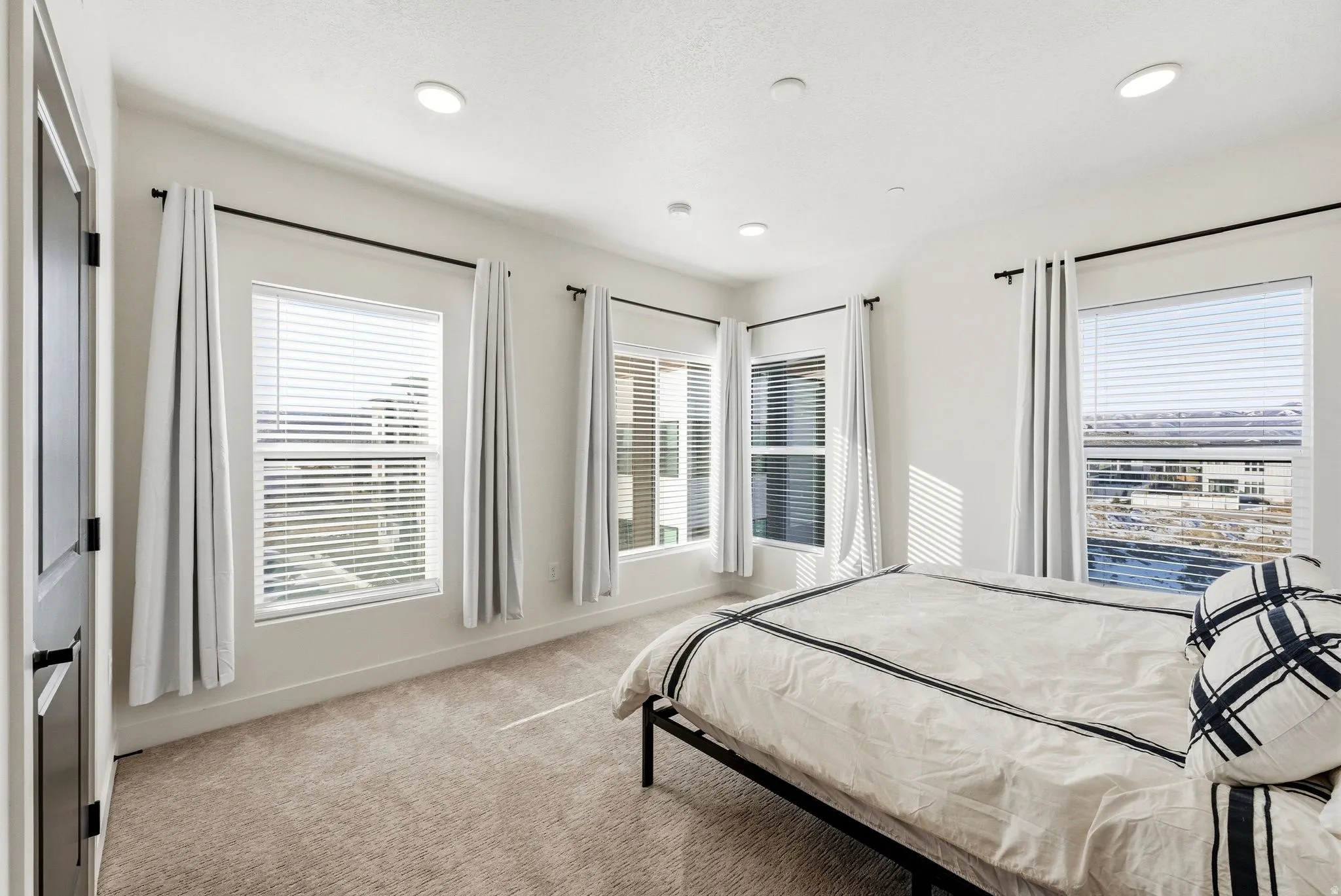 Bedroom featuring light colored carpet and recessed lighting