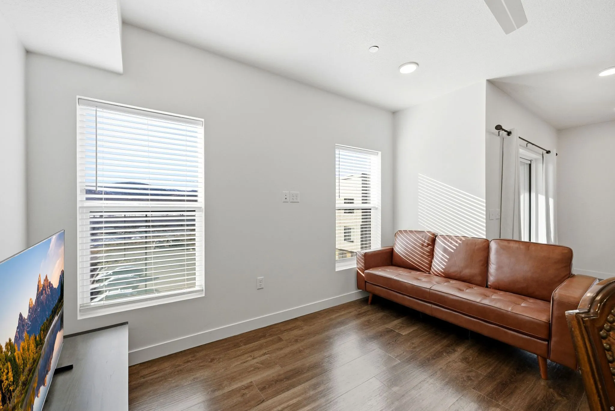 Living room featuring baseboards and wood finished floors