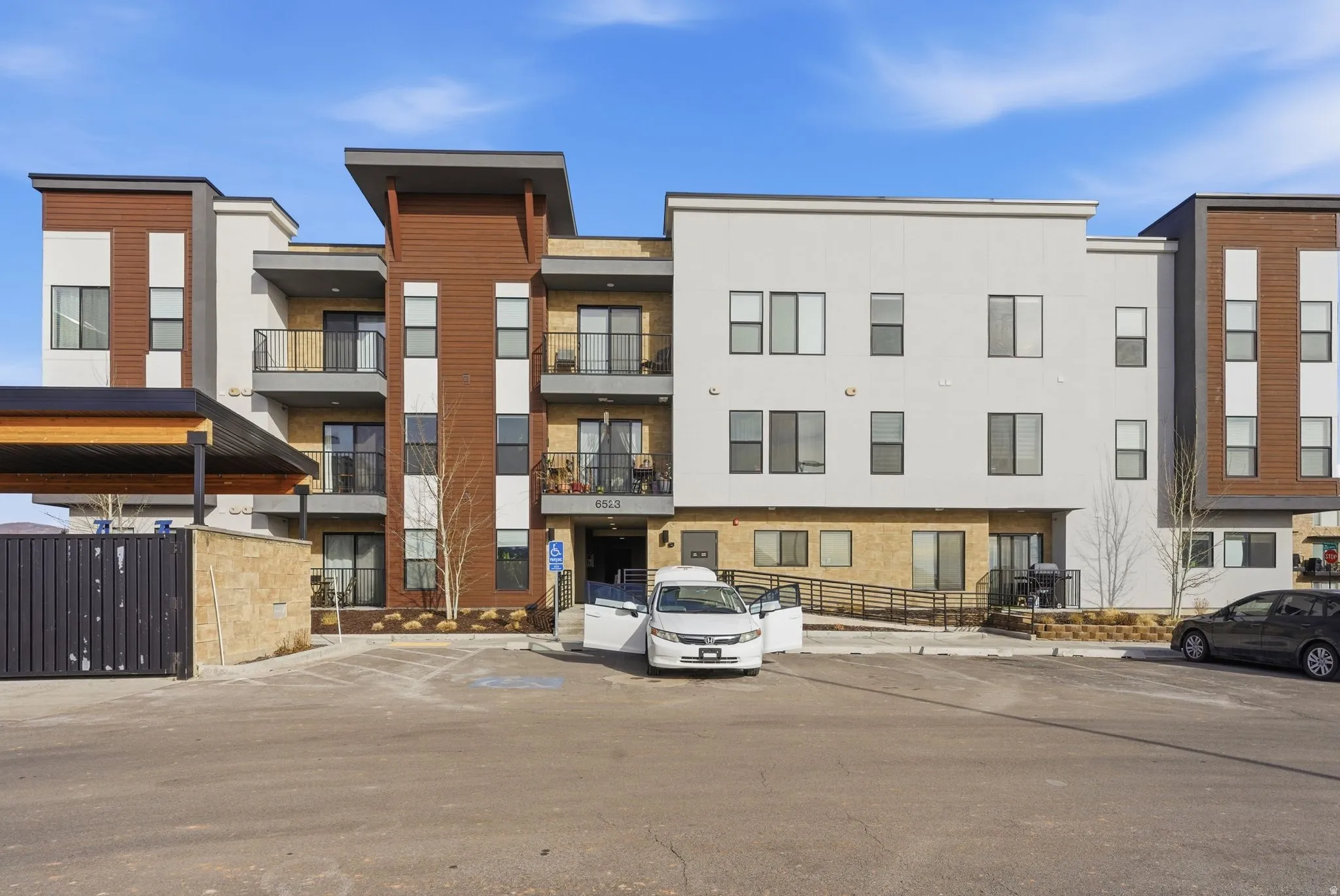 View of property with uncovered parking