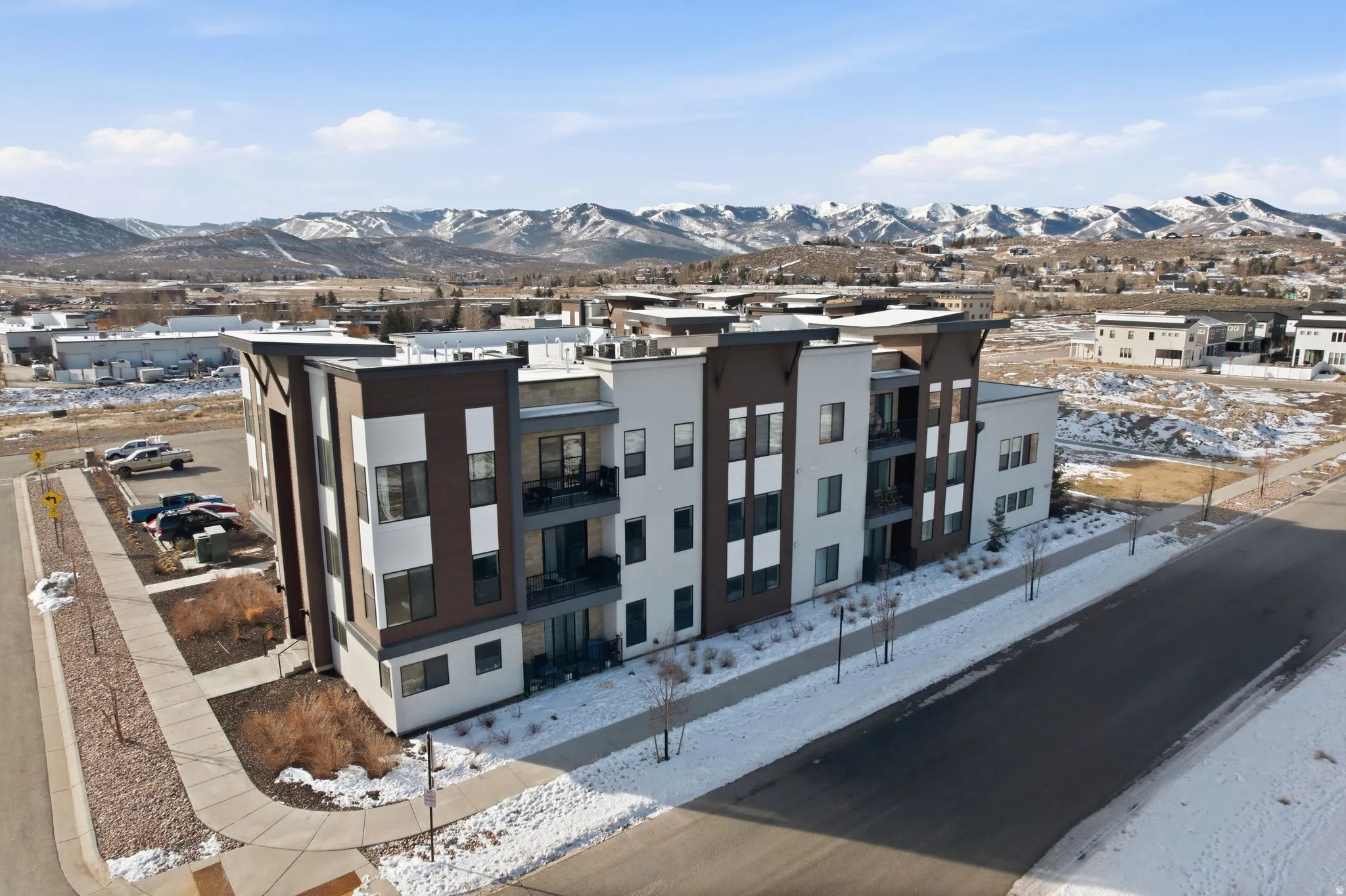 Snow covered building with a mountain view