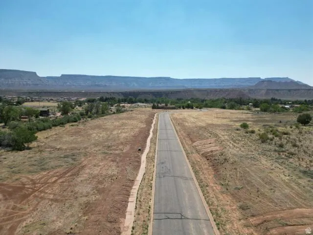 View of mountain backdrop with rural landscape