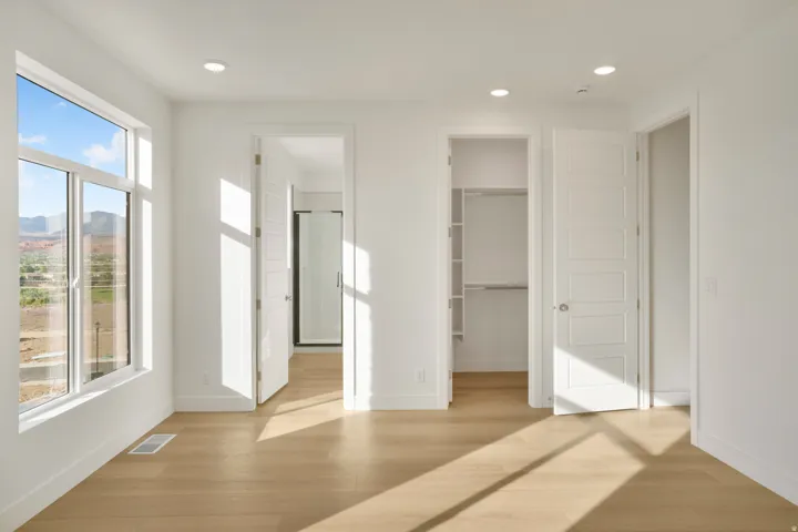 Bright interior featuring wood-finish flooring and recessed lighting