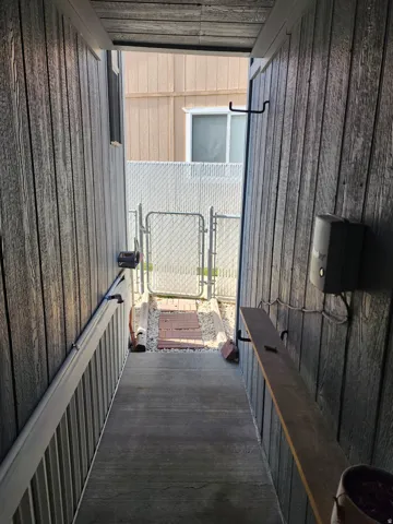 View of patio featuring a gate
