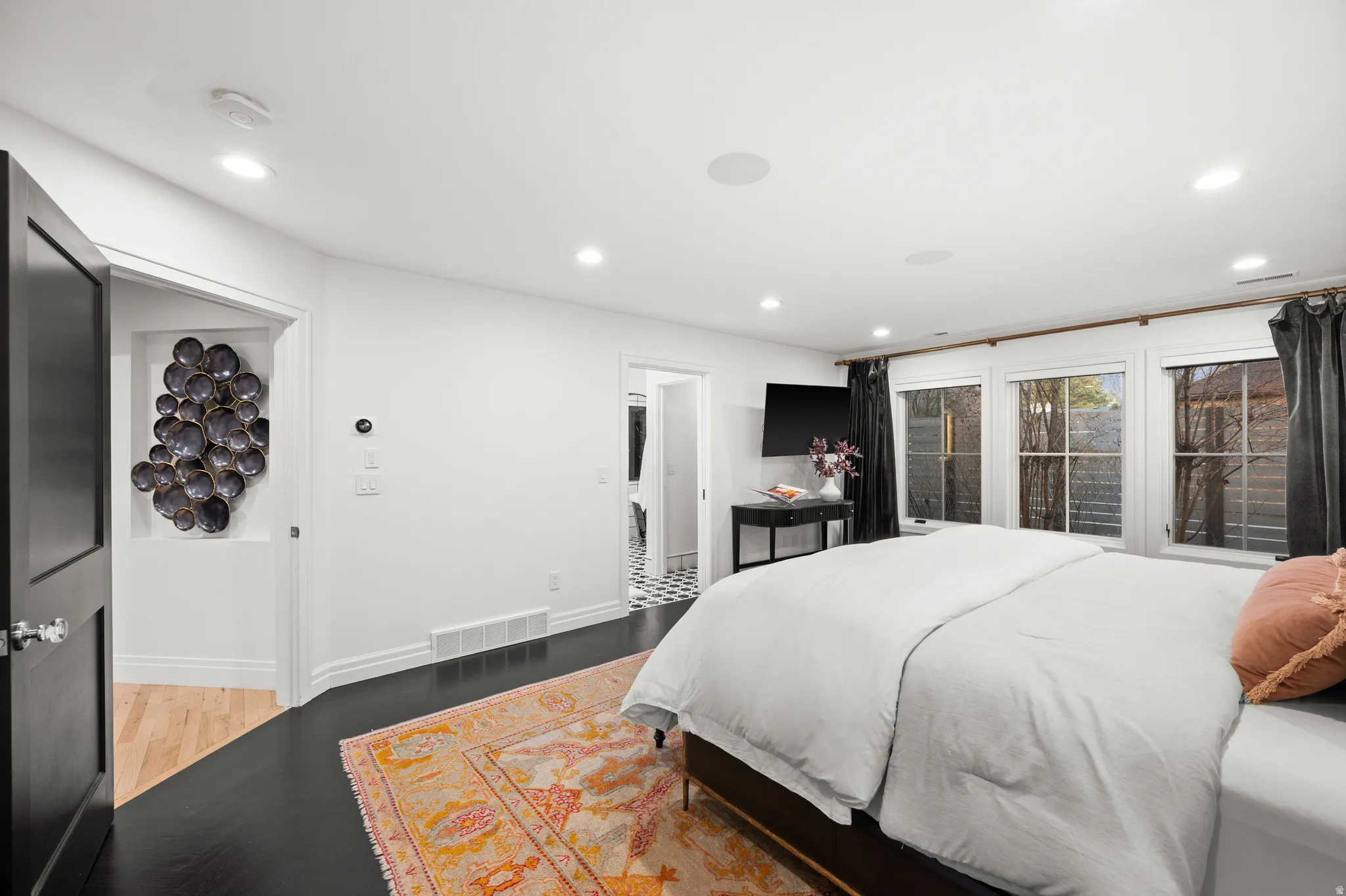 Master Bedroom with recessed lighting and wood finished floors