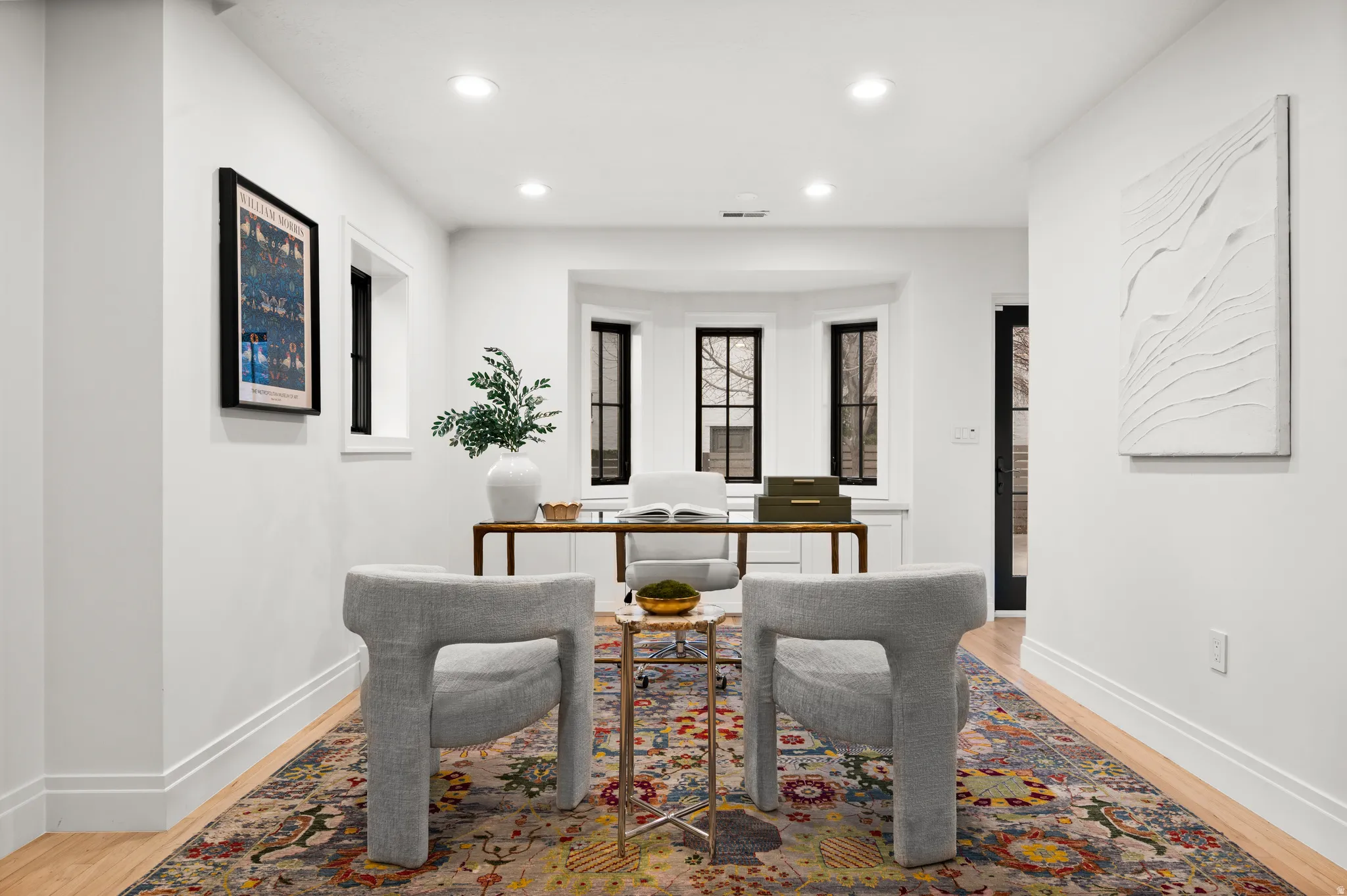 Dining area featuring a desk, recessed lighting, and light wood-style floors