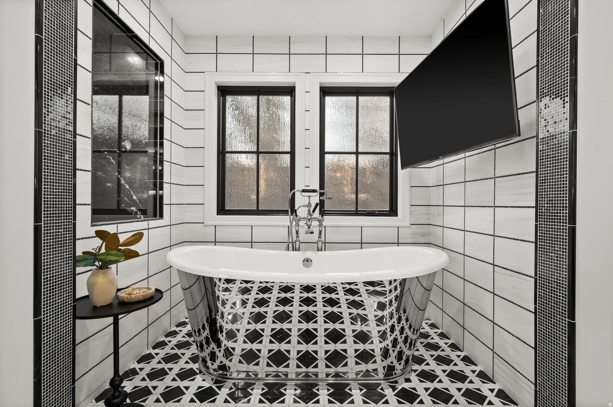 Master Bathroom with a soaking tub and tile walls