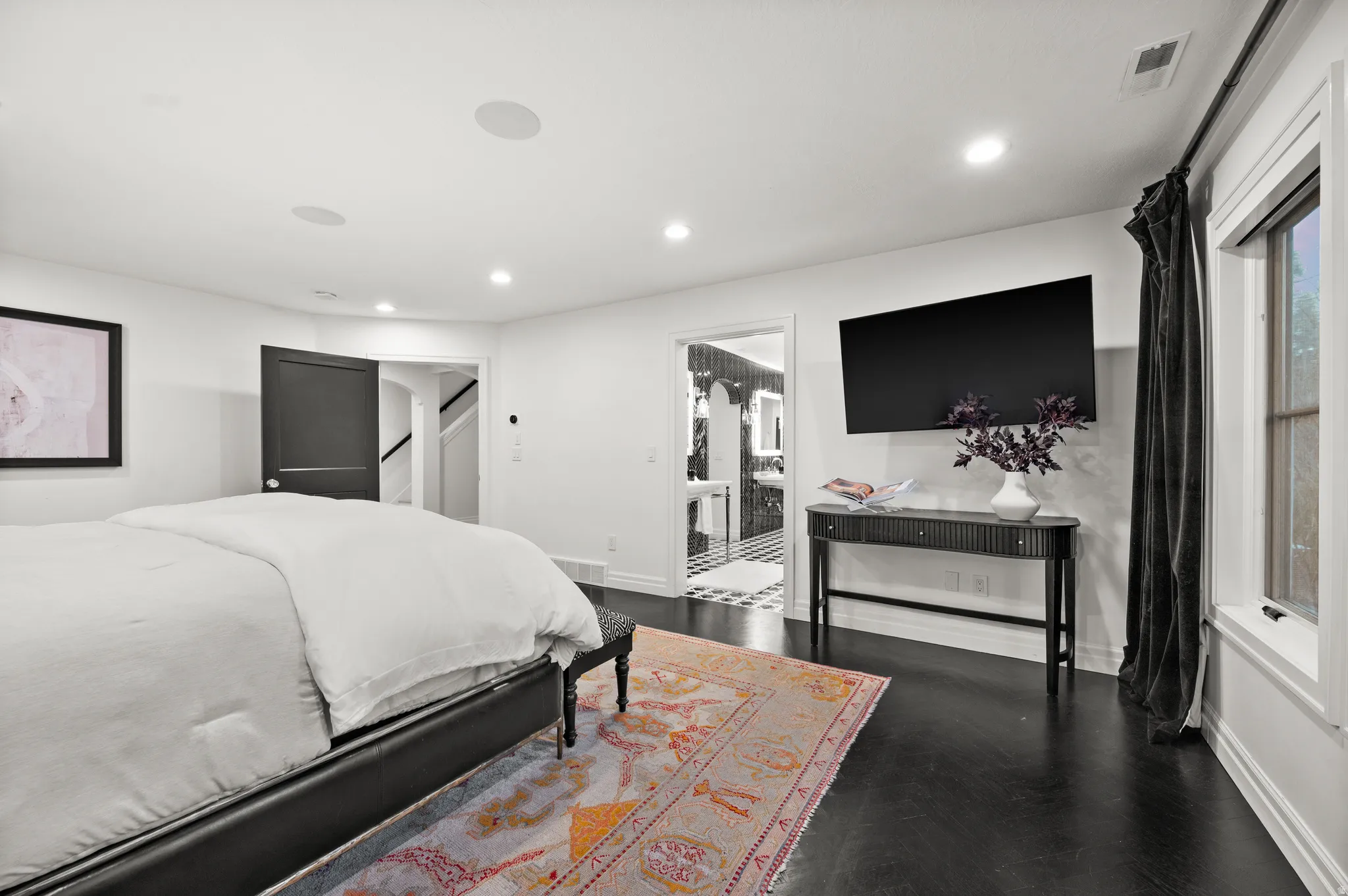 Master Bedroom with recessed lighting and dark wood-style floors