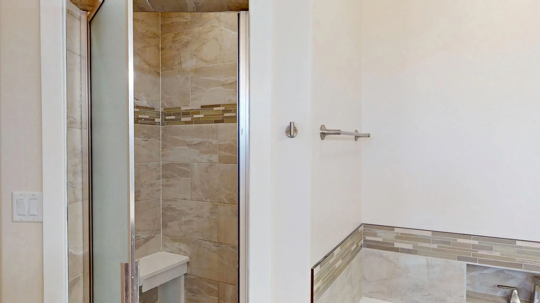 Bathroom featuring a shower stall