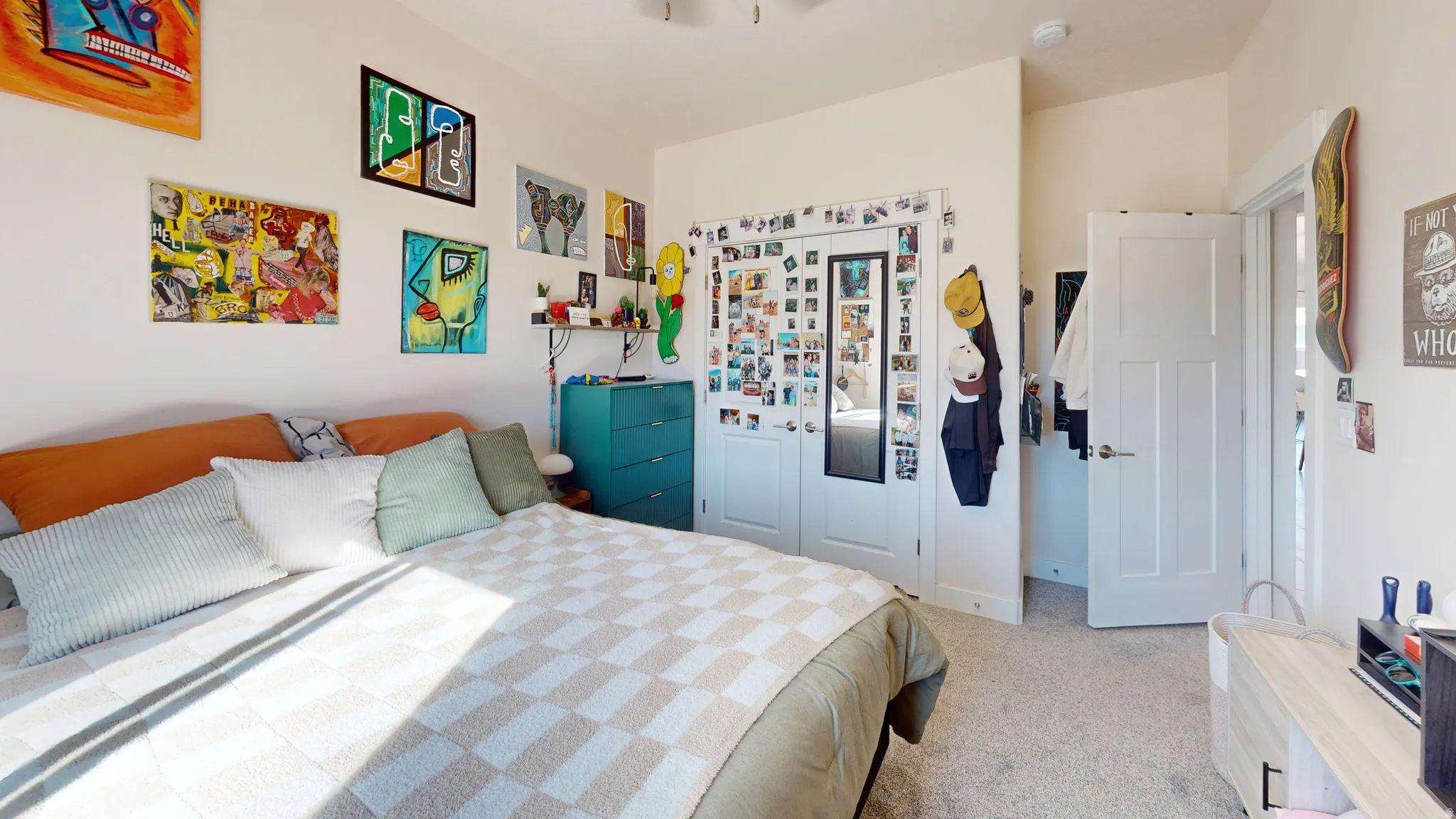 Bedroom with a closet and light carpet