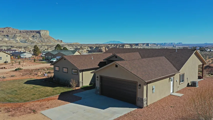 Aerial perspective of suburban area with a mountainous background