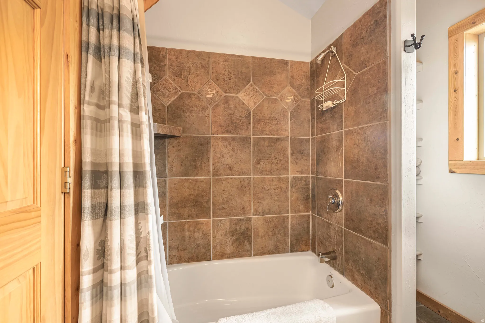 Full bath with shower / bath combination with curtain