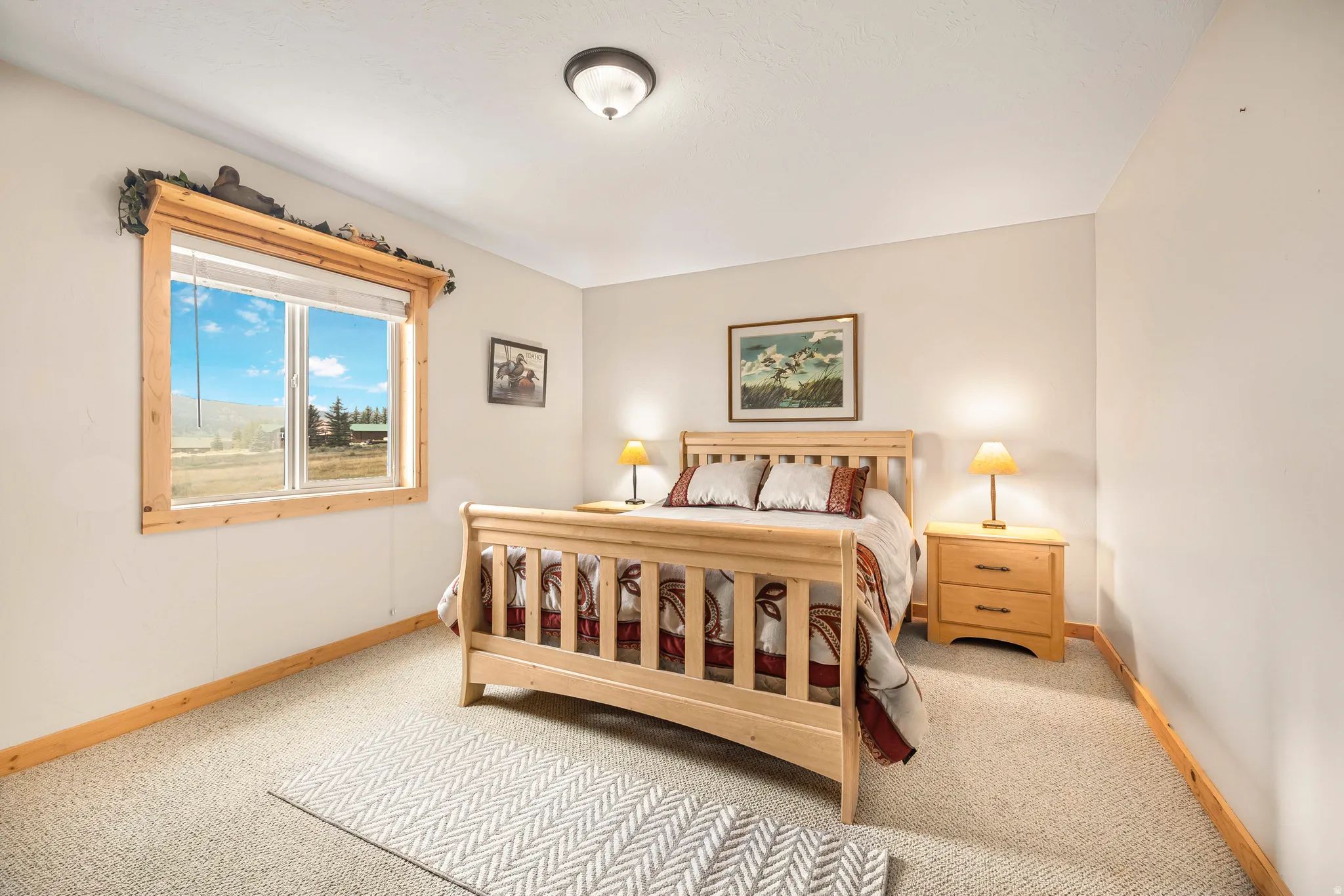 Carpeted bedroom with baseboards