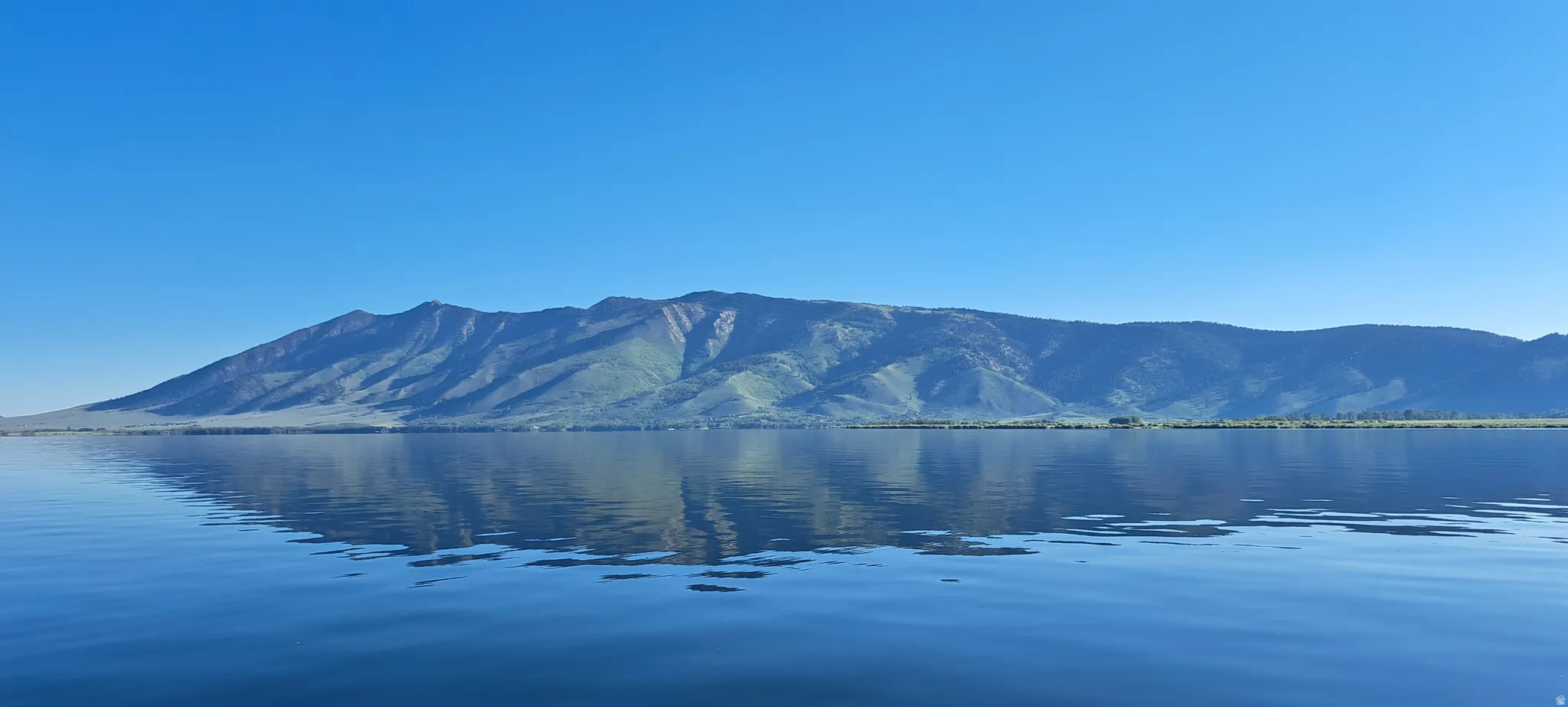 View of mountain background featuring a large body of water