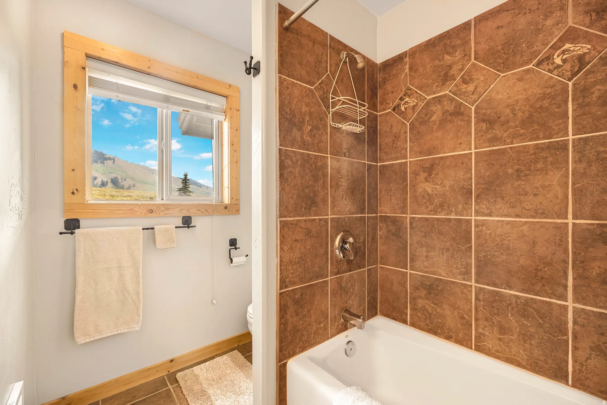 Full bathroom with shower / bathtub combination and tile patterned flooring