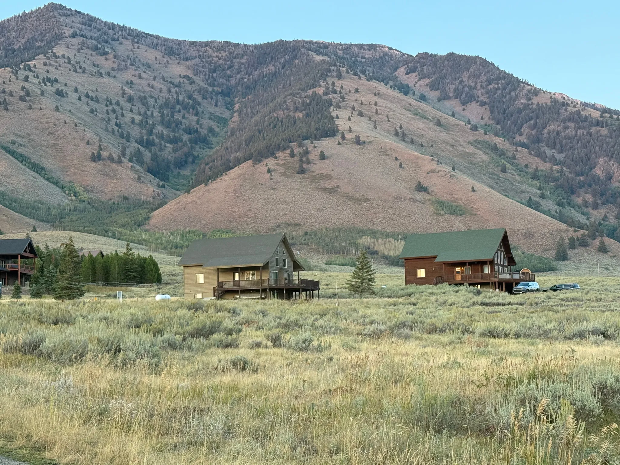 View of mountain background featuring rural landscape