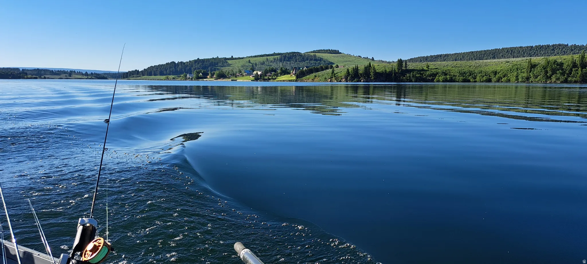 Water view featuring a forest and mountains