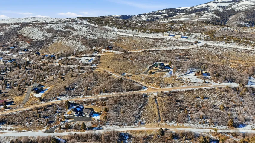 Snowy aerial view with a mountain view