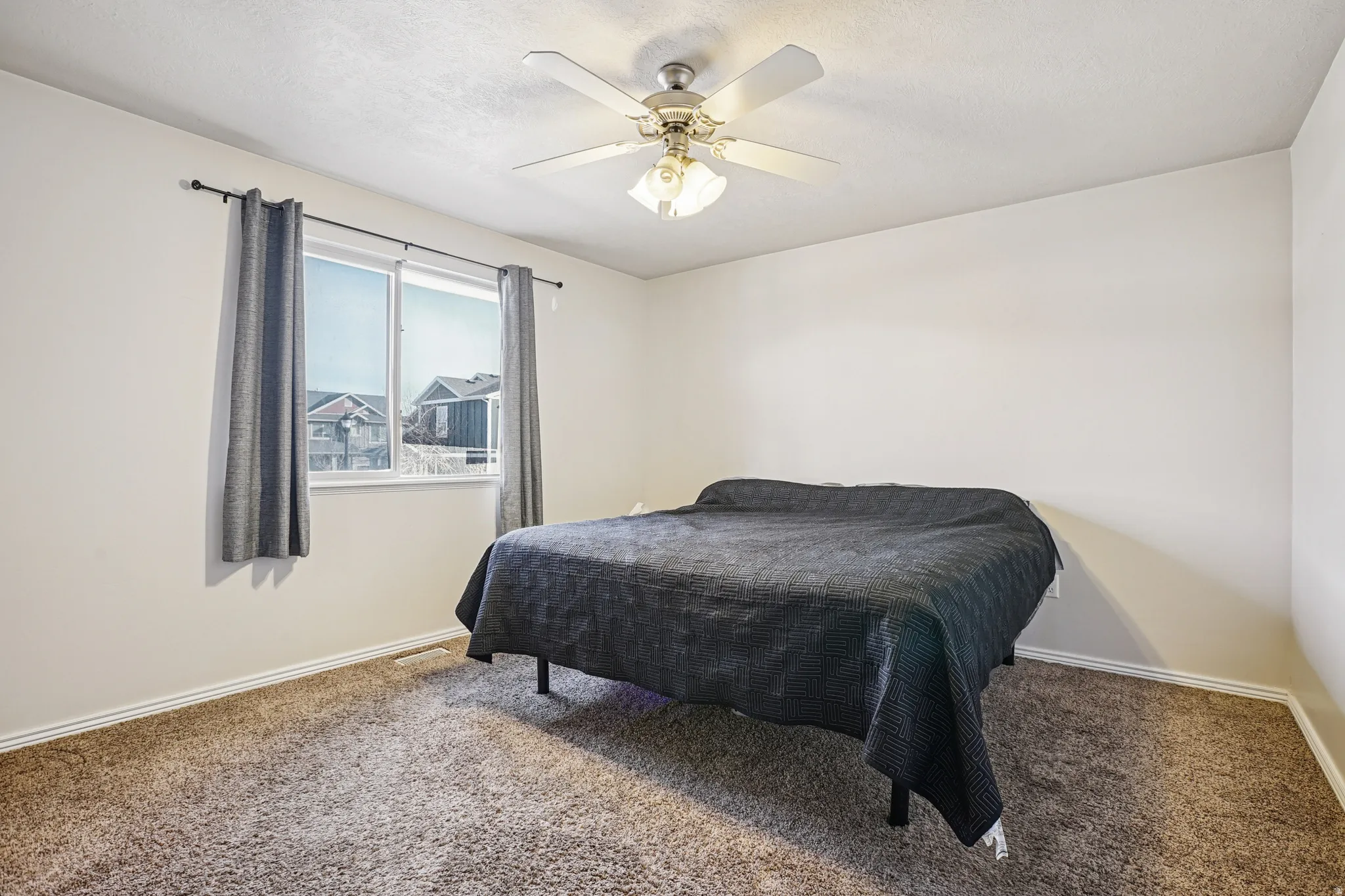 Bedroom featuring carpet flooring and a ceiling fan