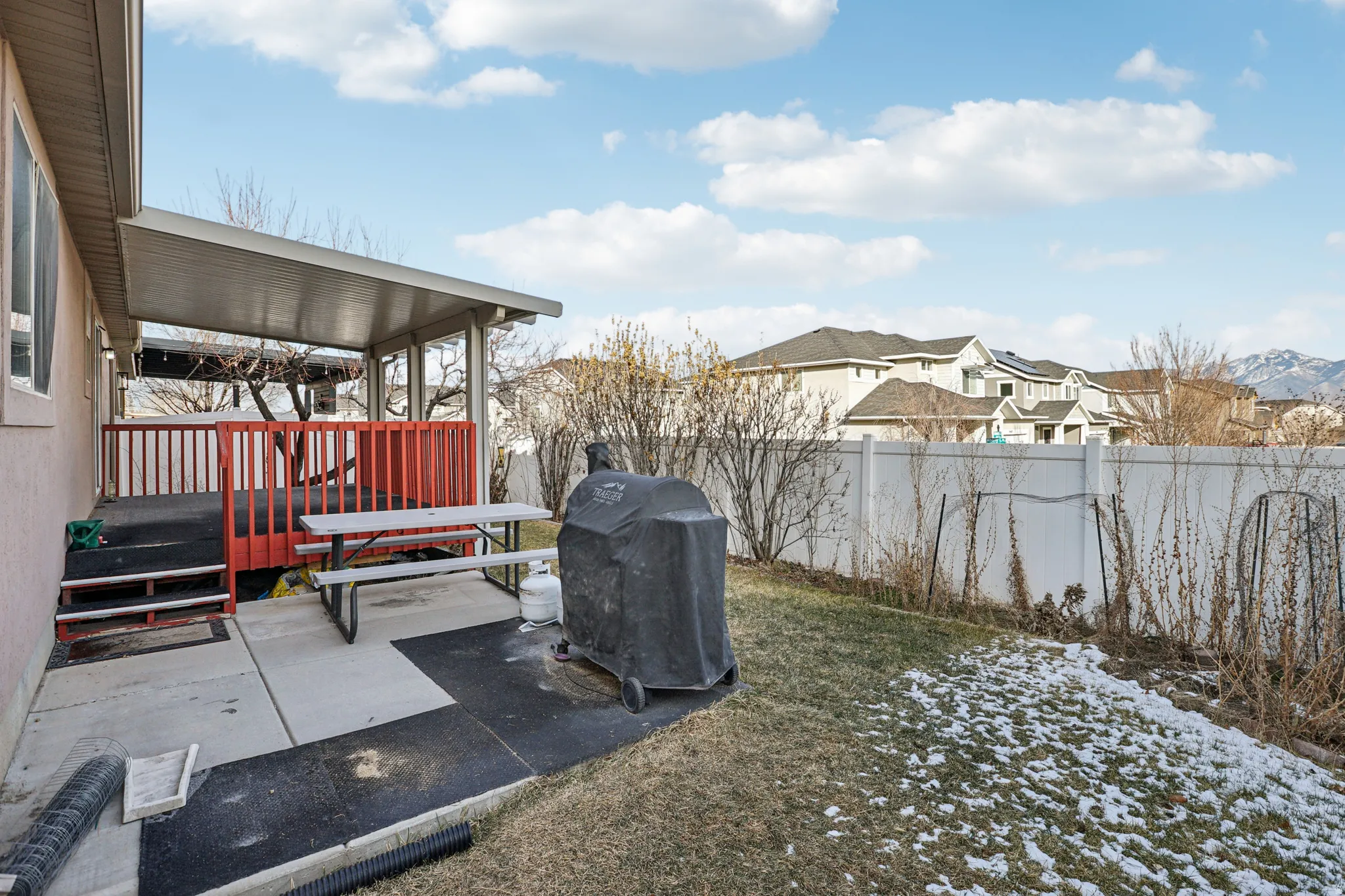 Fenced backyard with a residential view
