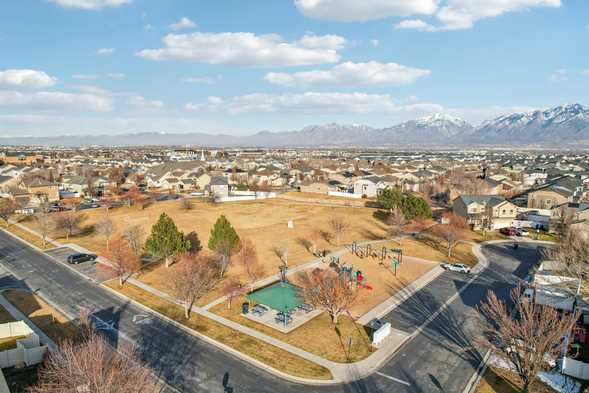 Aerial view of residential area featuring a mountain backdrop