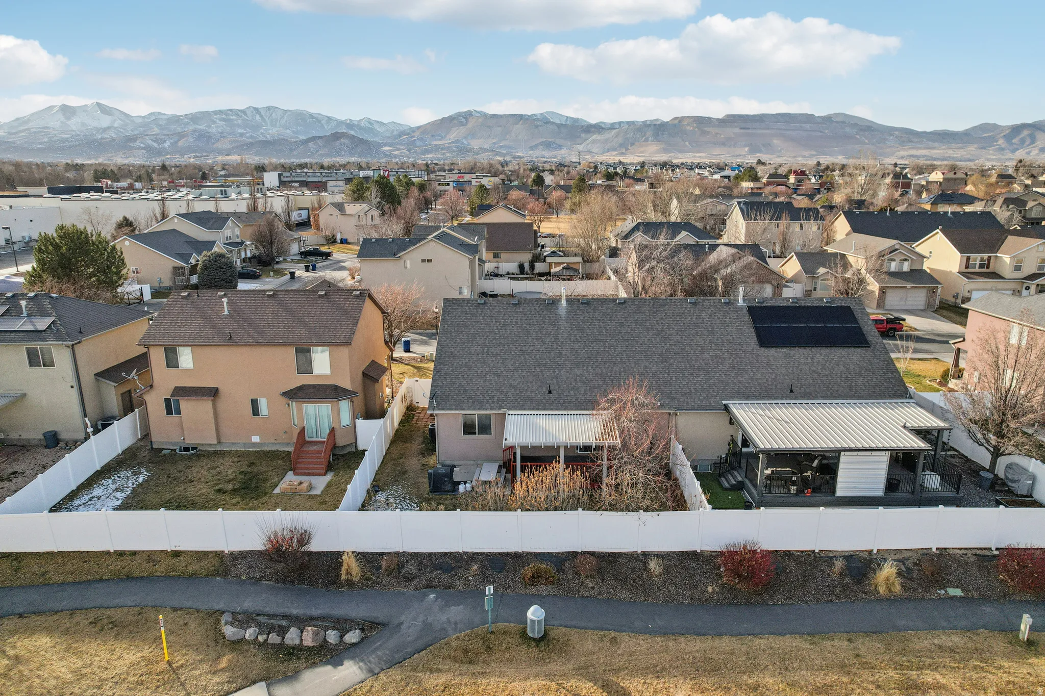 Aerial view of residential area featuring mountains