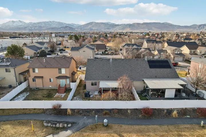 Aerial view of residential area featuring mountains