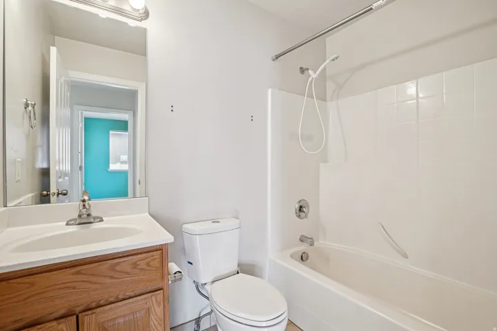Bathroom featuring washtub / shower combination and vanity