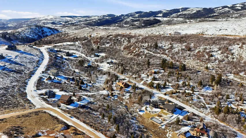 Snowy aerial view featuring a mountain view