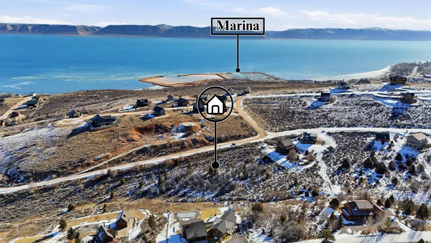 Aerial view of property's location with a mountainous background