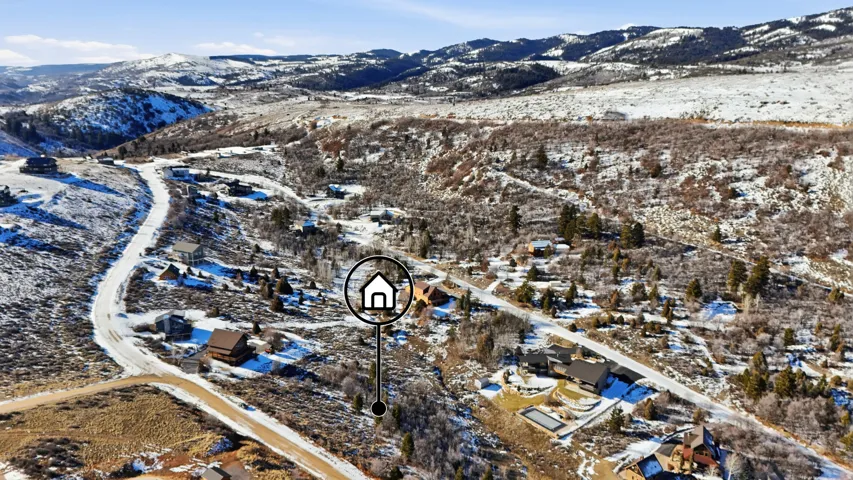 Snowy aerial view with a mountain view