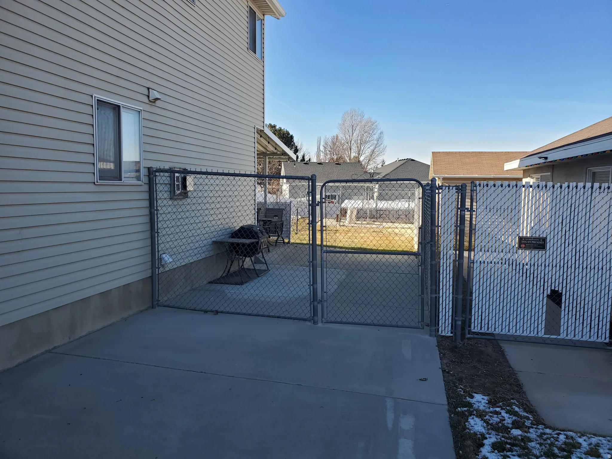 Gate featuring a patio