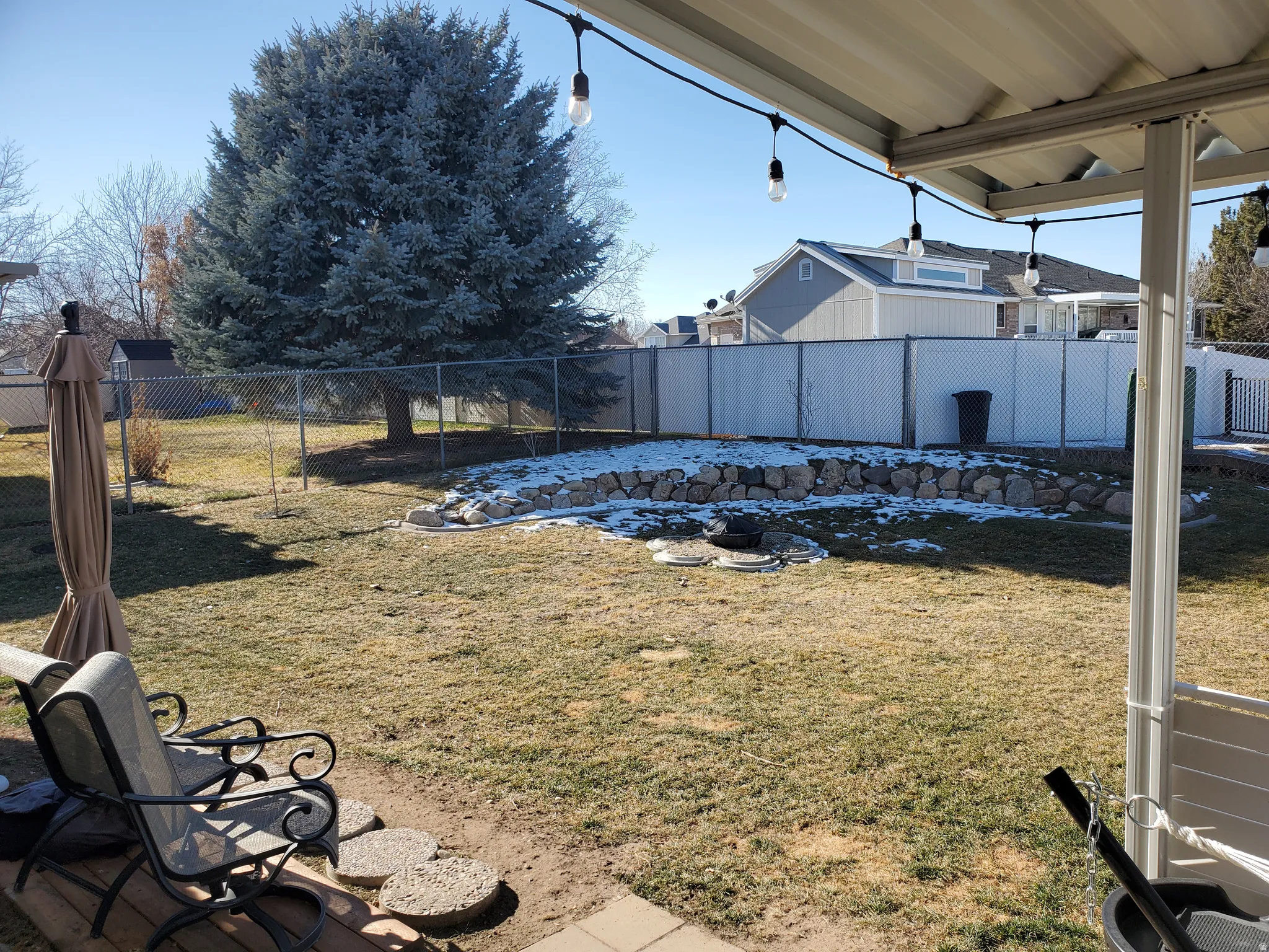 View of fenced backyard