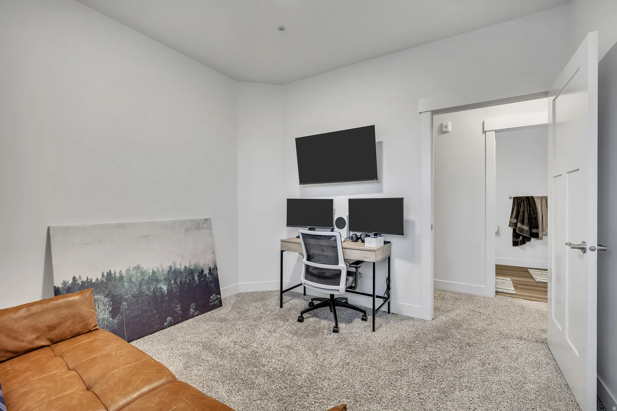 Office area featuring carpet floors and baseboards