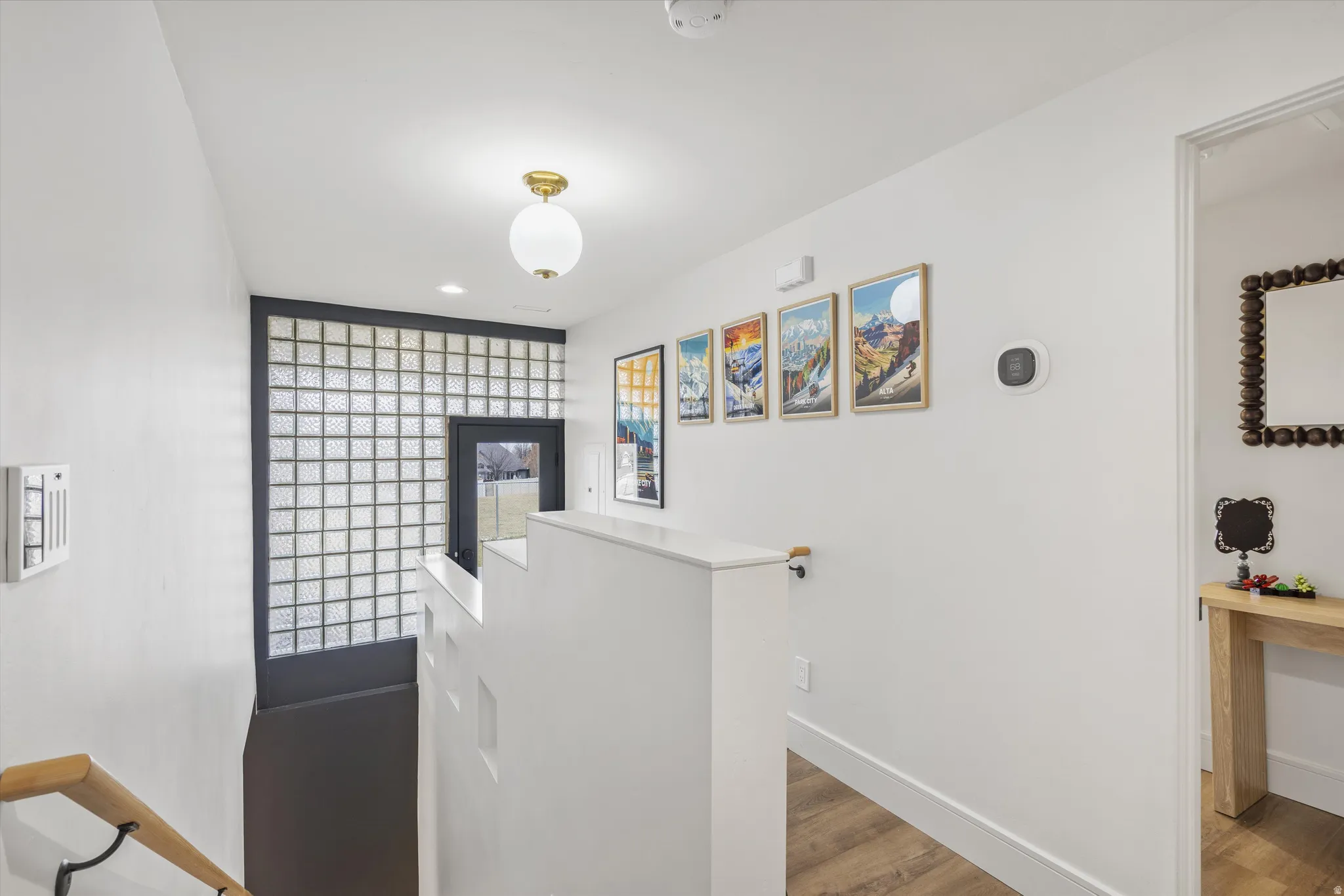 Corridor featuring light wood-style floors