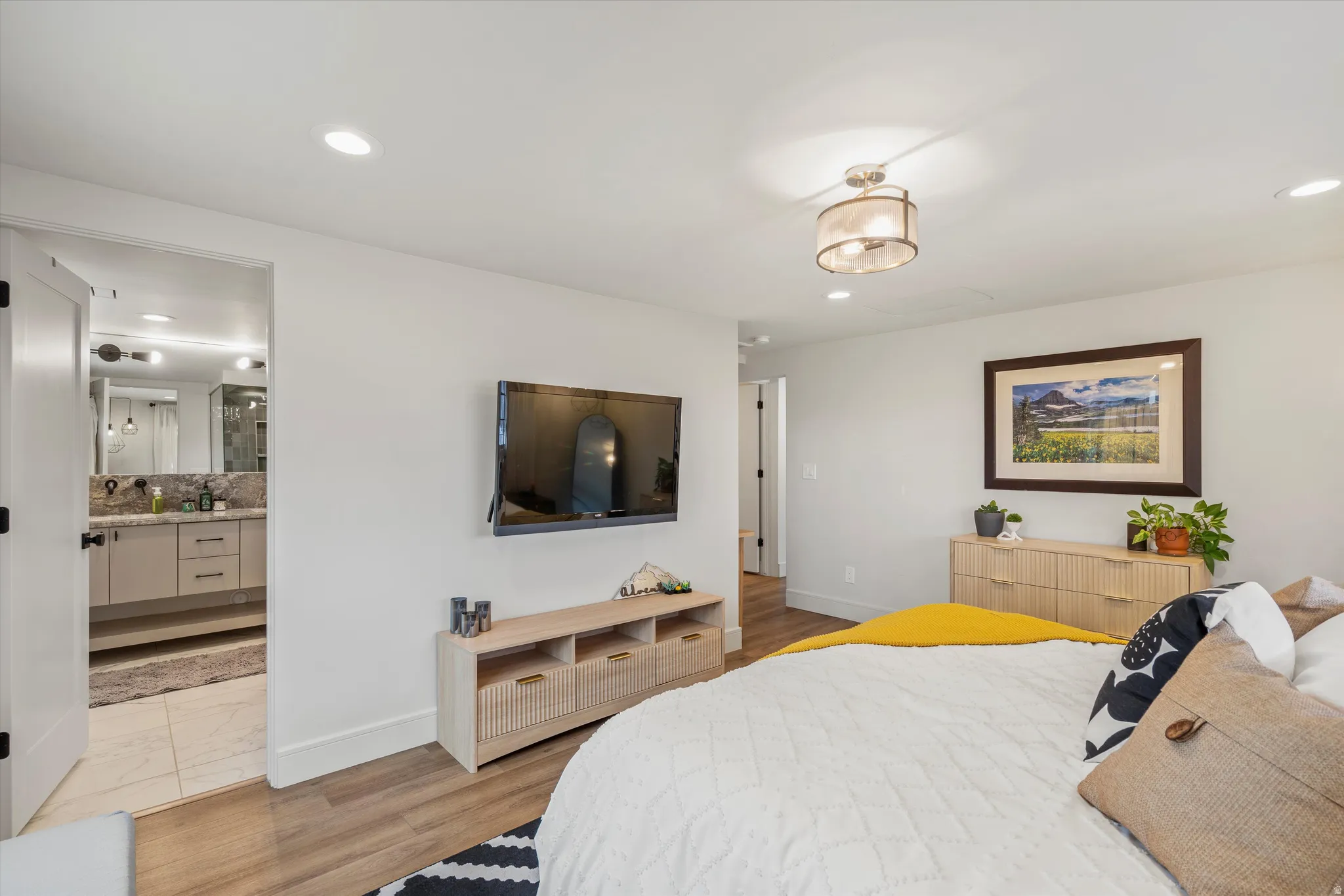 Primary Bedroom featuring light wood-style flooring and recessed lighting