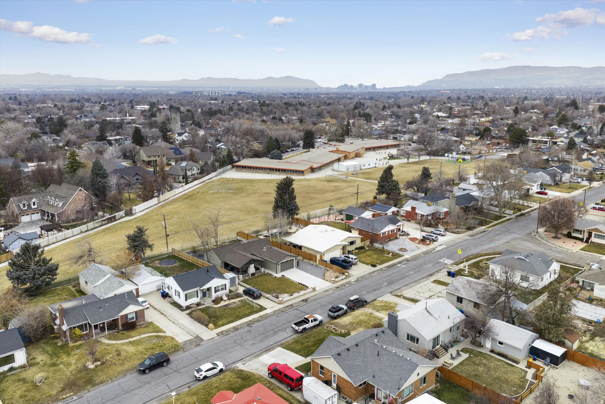 View of property location with nearby suburban area and mountains
