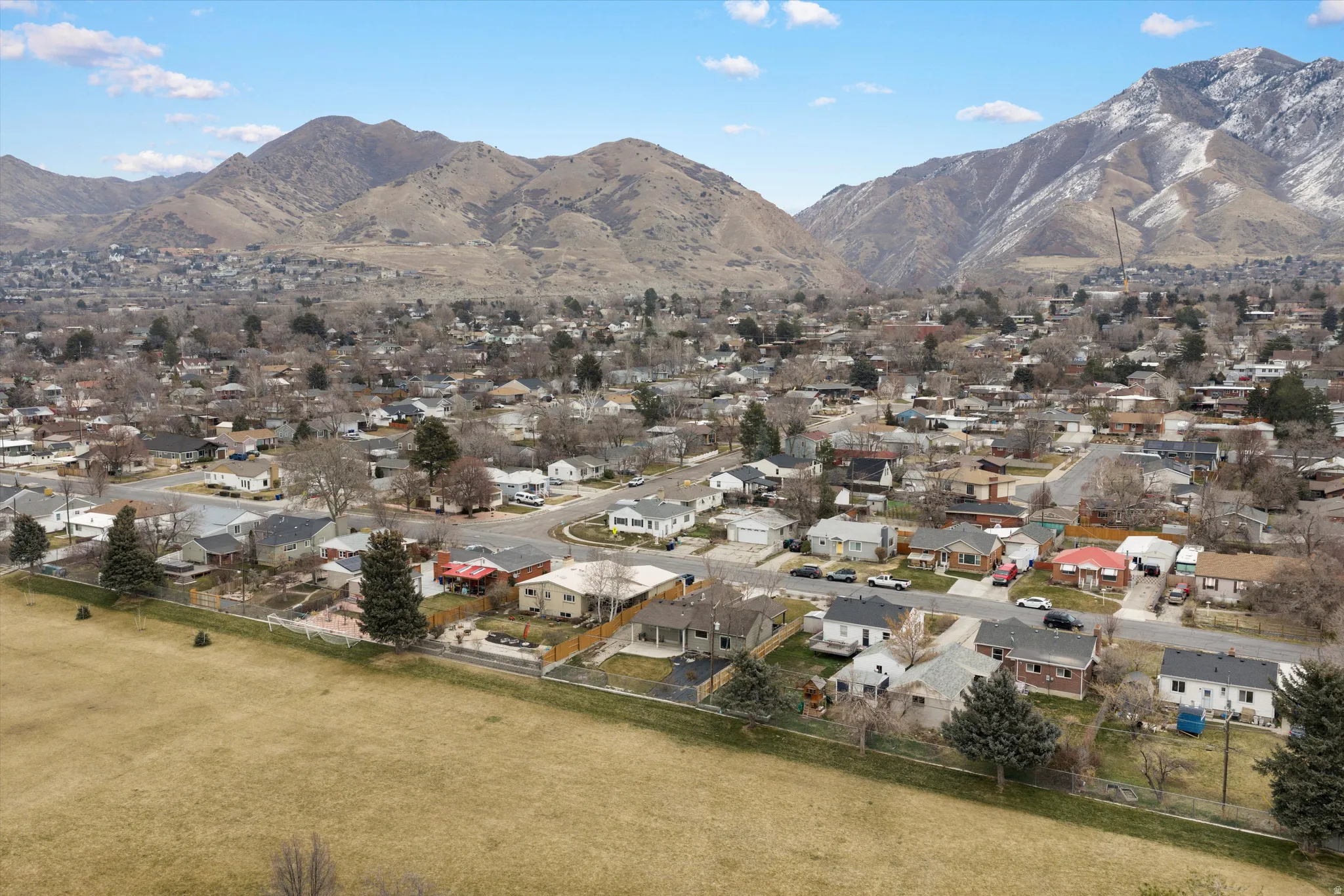 View of mountain background featuring nearby suburban area