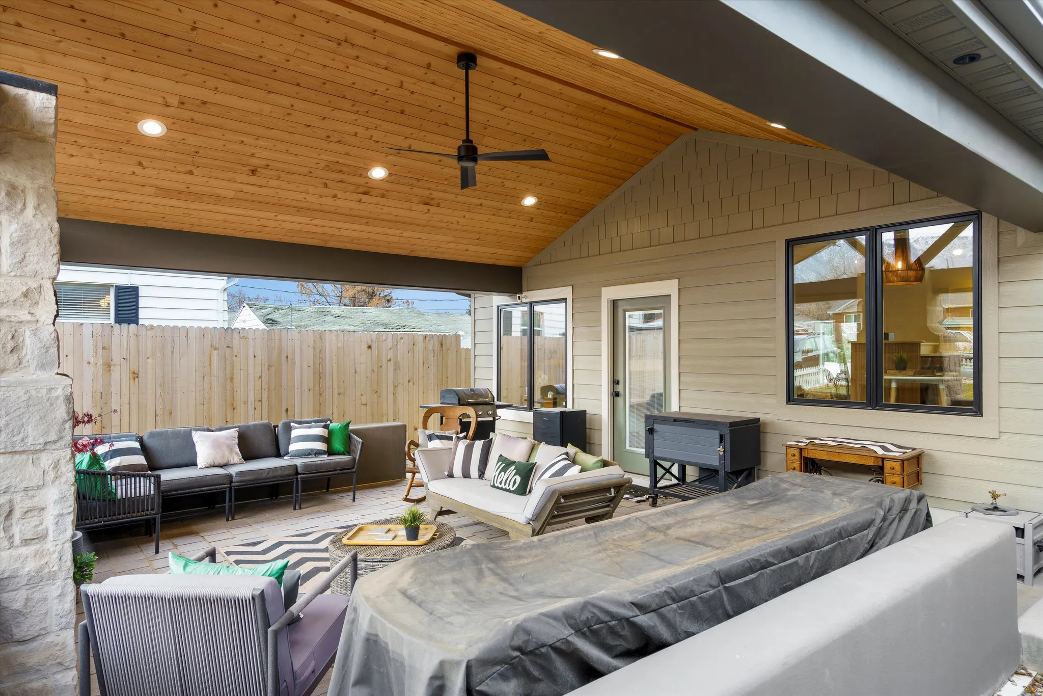 View of patio featuring an outdoor living space and a ceiling fan
