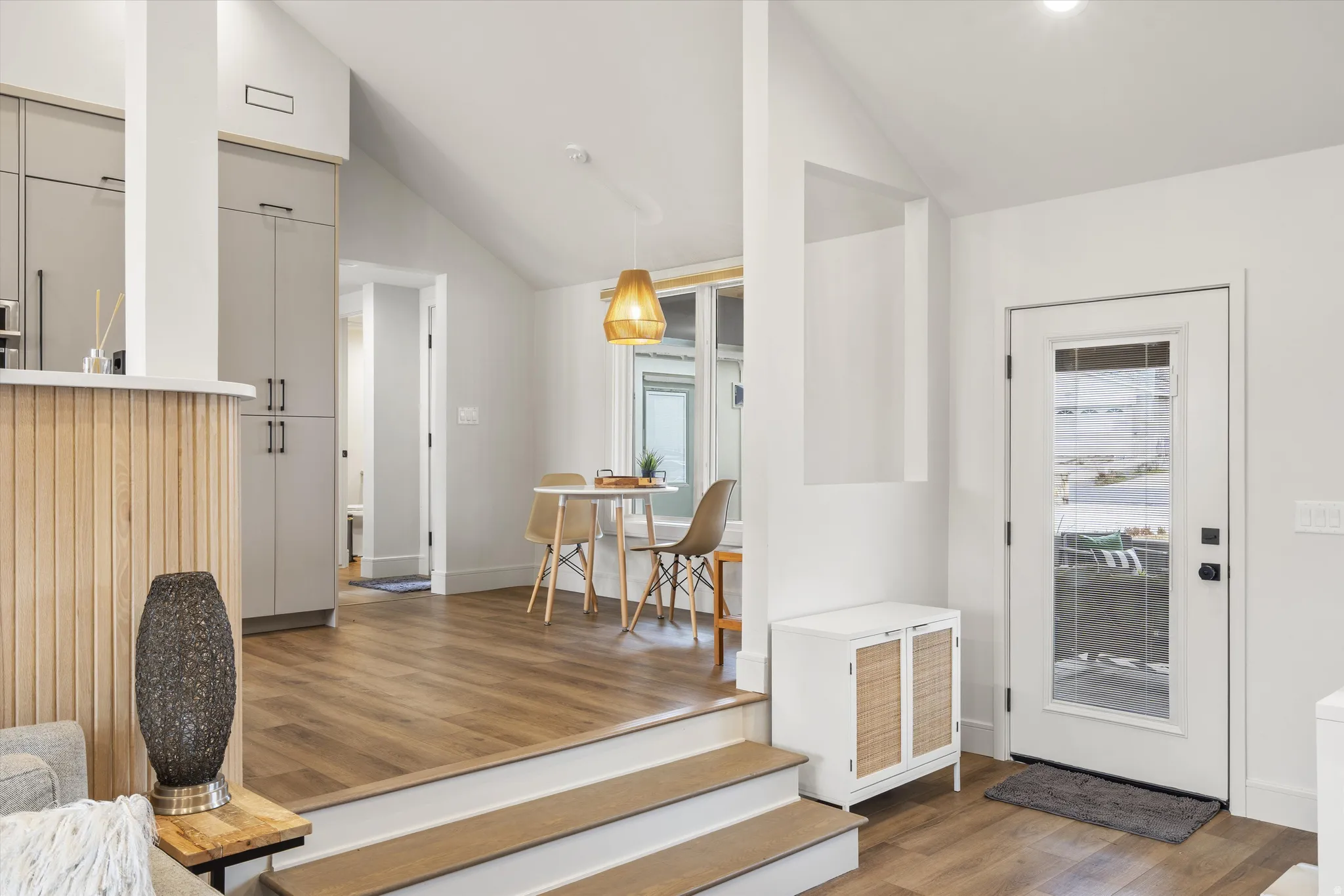 Foyer featuring dark wood finished floors and high vaulted ceiling