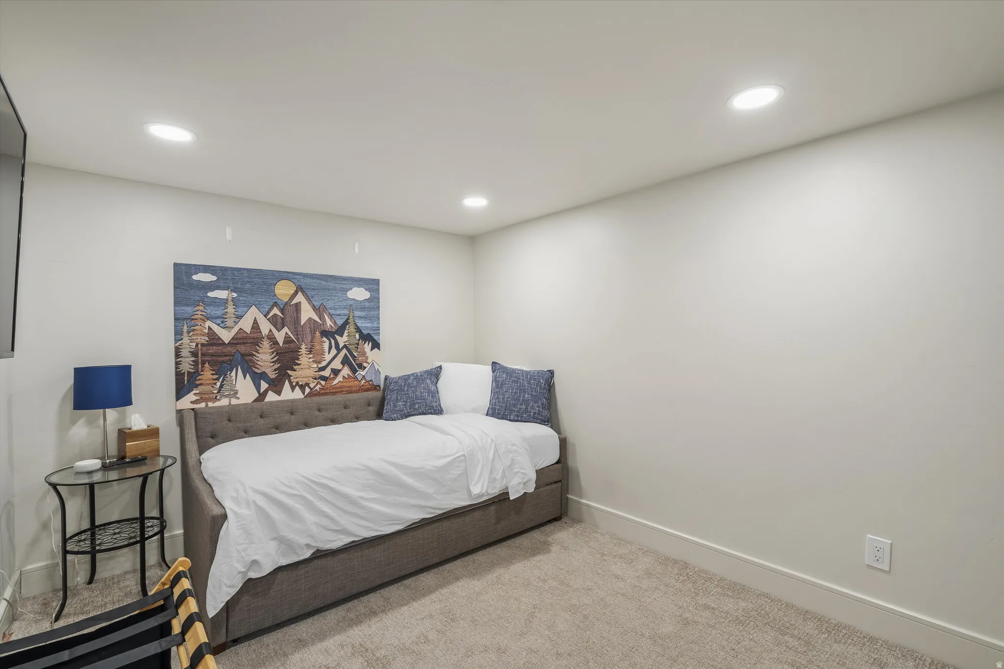 Basement bedroom featuring baseboards and recessed lighting