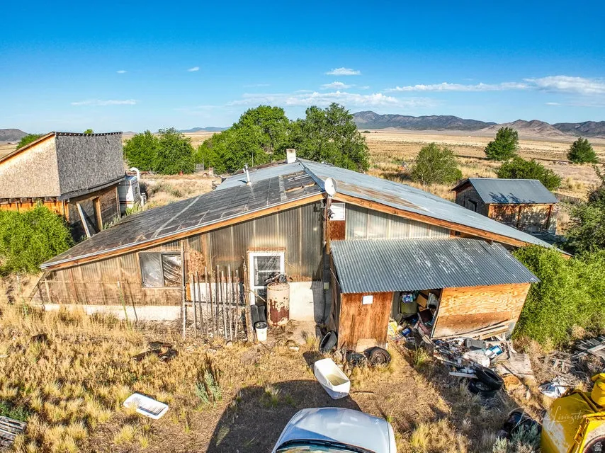 View of front facade with a mountain view and a metal roof