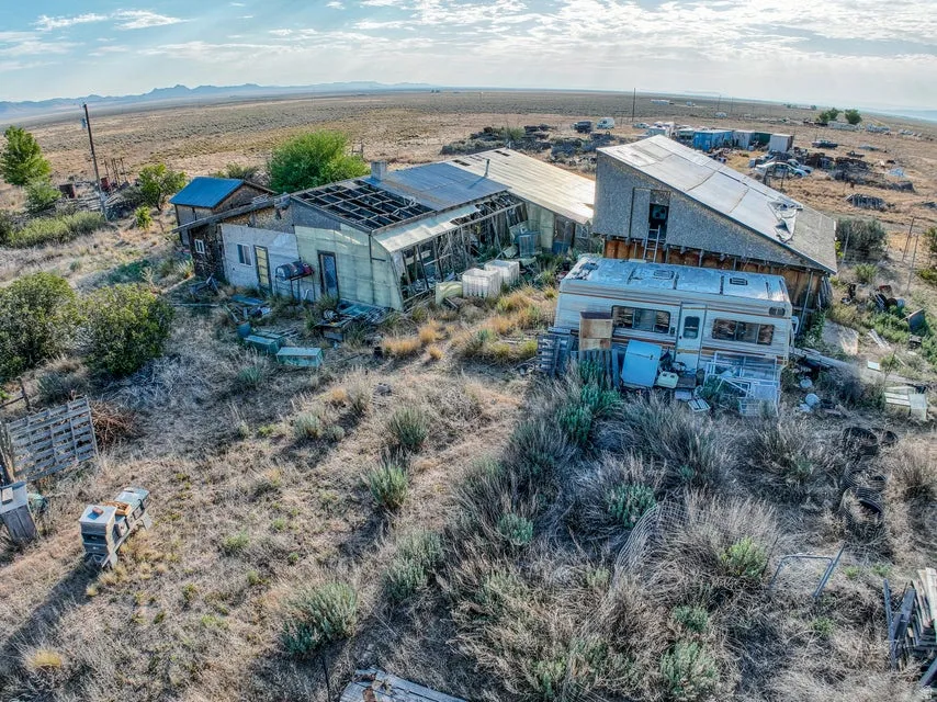 View of rural area featuring a mountainous background and a desert landscape