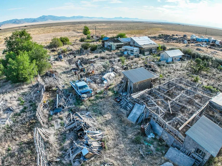 Overview of rural landscape featuring a mountain backdrop
