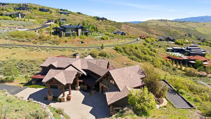 Expansive multi-level property with a prominent covered portico entry
