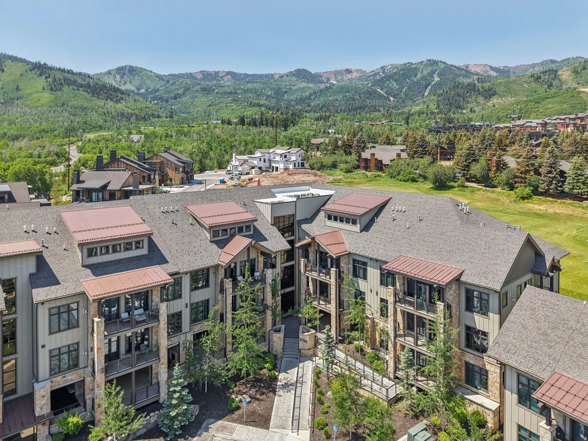 Aerial perspective of suburban area with a mountainous background