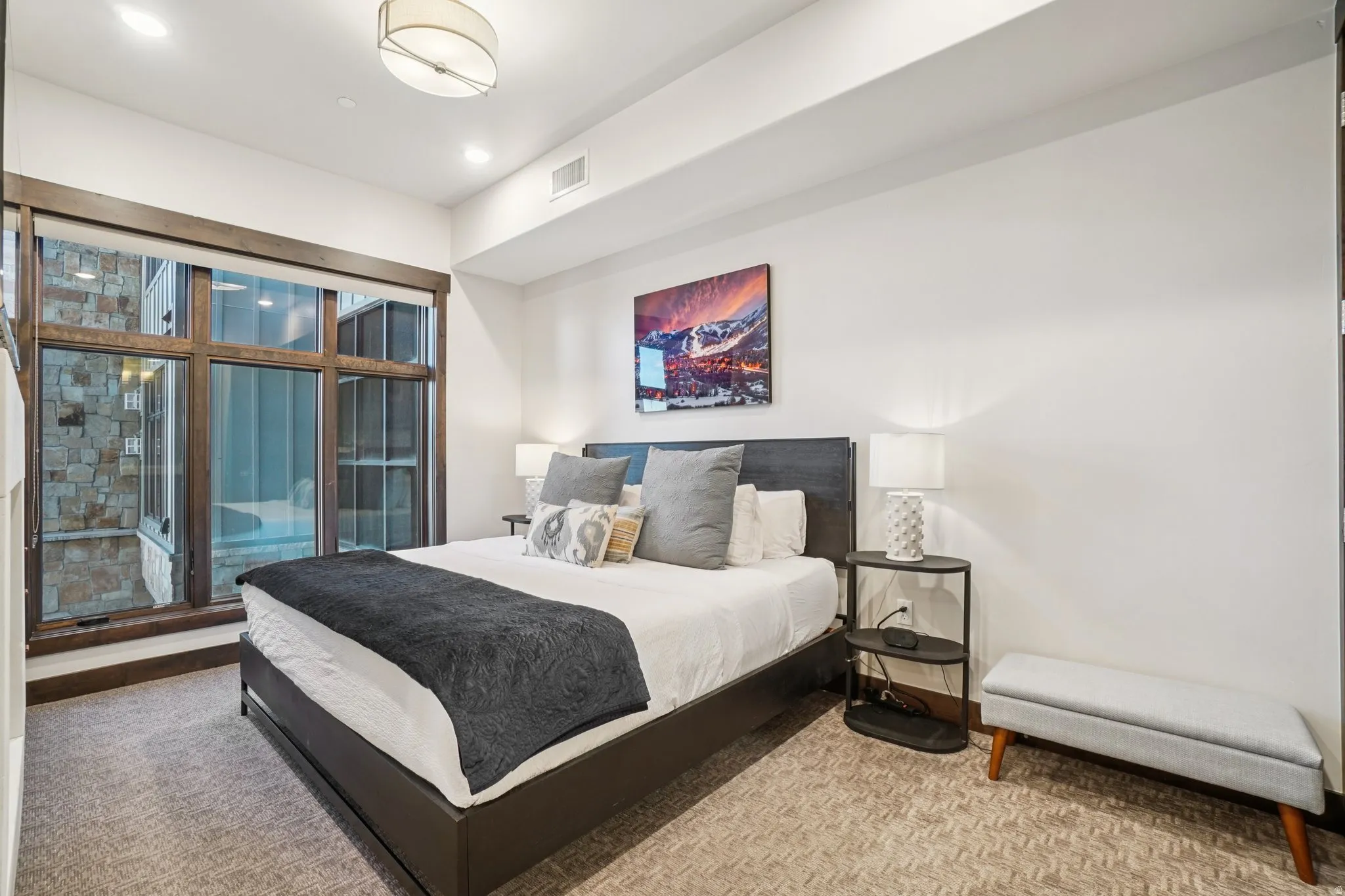 Carpeted bedroom with access to outside