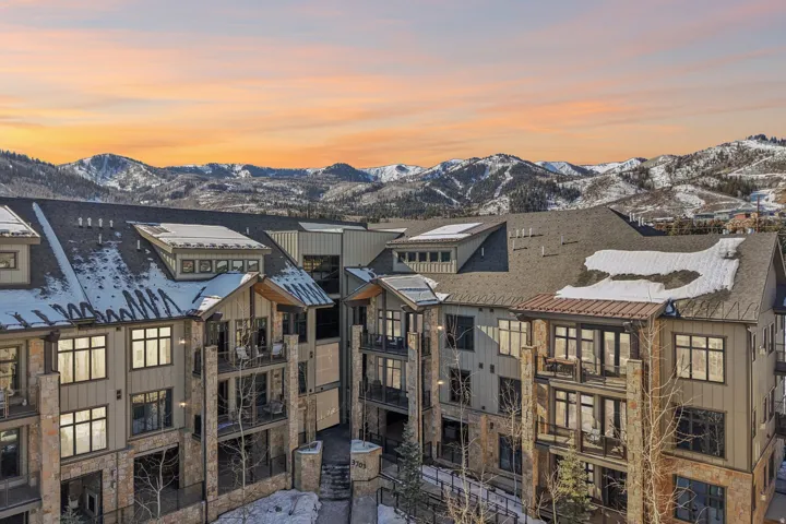 Property at dusk featuring a mountain view