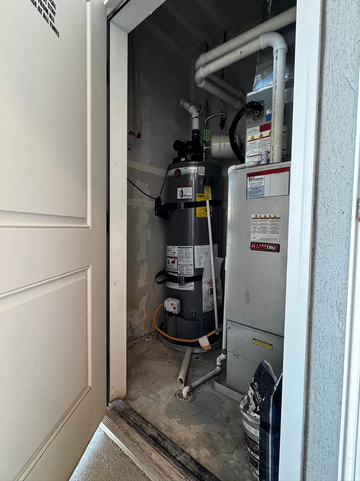 Utilities featuring water heater and heating unit