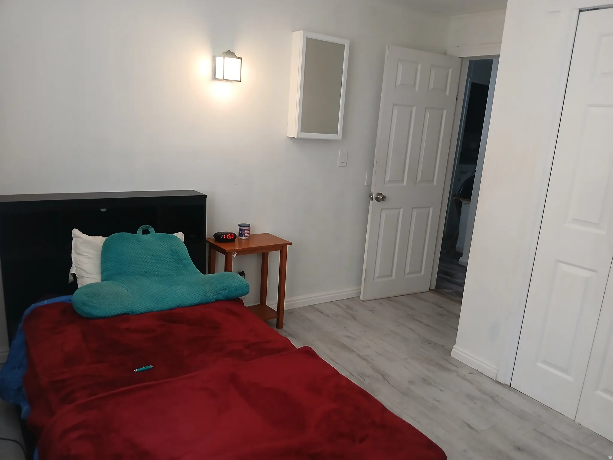 Bedroom featuring baseboards and light wood-type flooring