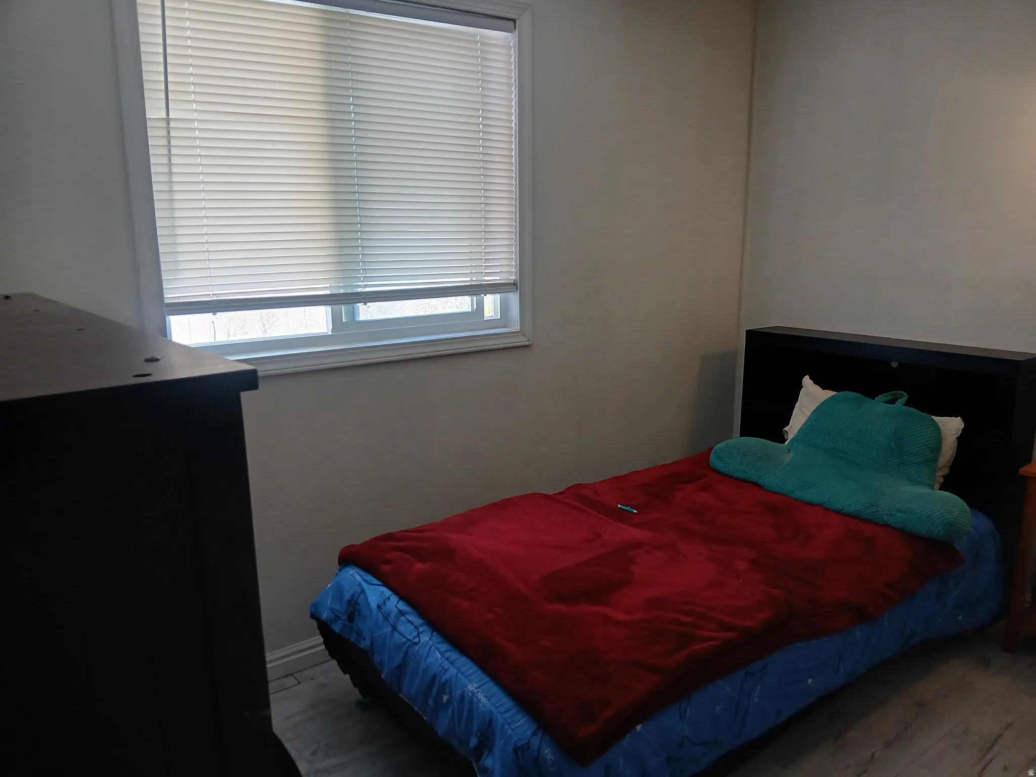 Bedroom with wood finished floors